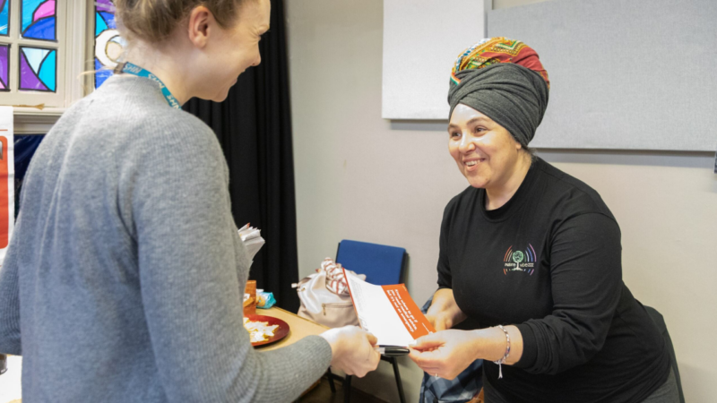 Two women smiling at each other