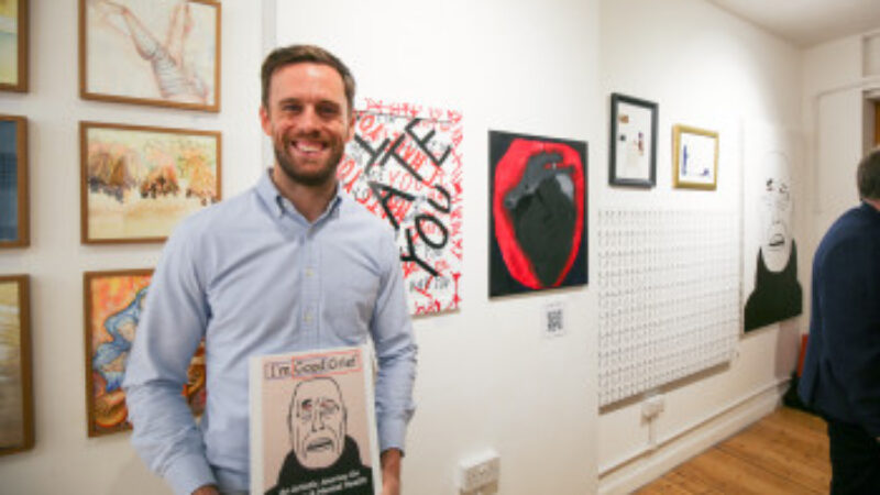 Leo with his book titled I'm Good Grief: An Artistic Journey On Emotions & Mental Health