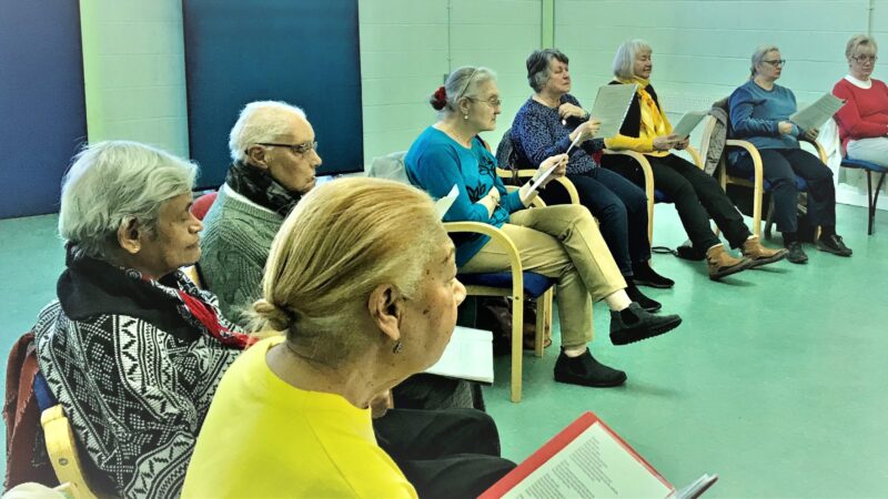People singing in a group at Attic Theatre's Going for a Song workshop