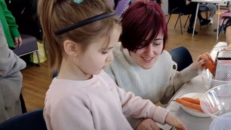 Children and parents cooking together at one of Sutton's family hub