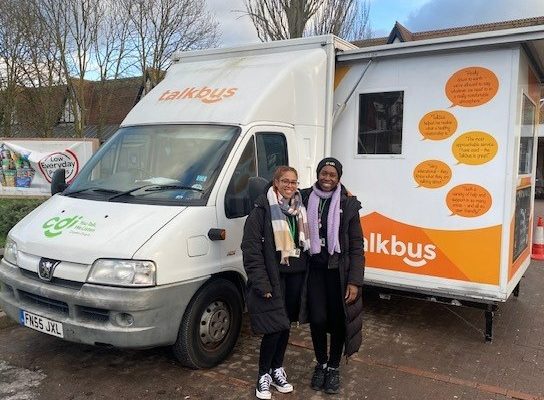 Jess, Community Outreach Worker, and Una, Senior Outreach Worker, standing in front of the Croydon Drop In Talkbus